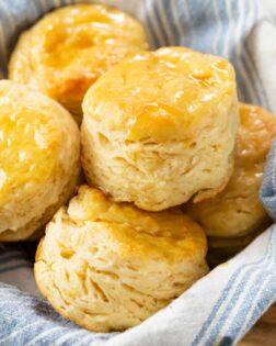 A bowl filled with fluffy Buttermilk Biscuits.