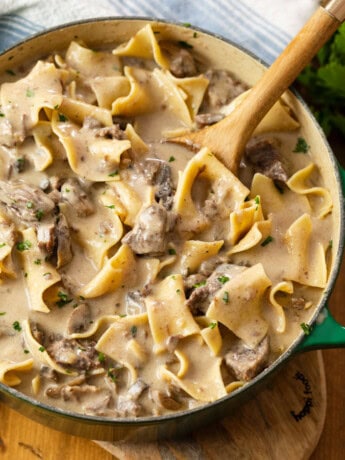 A dutch oven filled with hearty Beef Stroganoff made in the Slow Cooker.