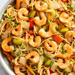 Shrimp Lo Mein in a skillet with vegetables, noodles, and sauce.