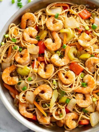 Shrimp Lo Mein in a skillet with vegetables, noodles, and sauce.